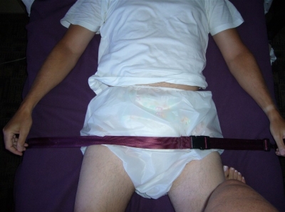 Tied to the bed
Have to wear a diaper in a situation like this
