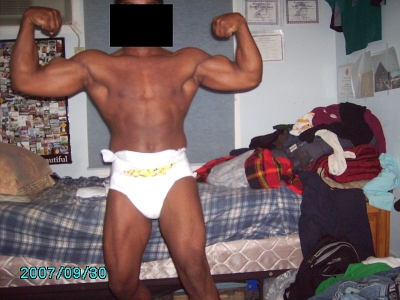 front double bicepts while wearing a diaper
